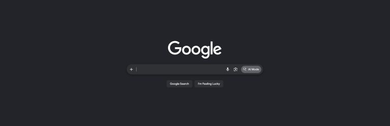 Google search homepage in dark mode with the AI Mode button beside the search bar